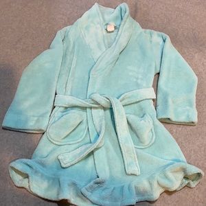 Light blue girl’s robe.